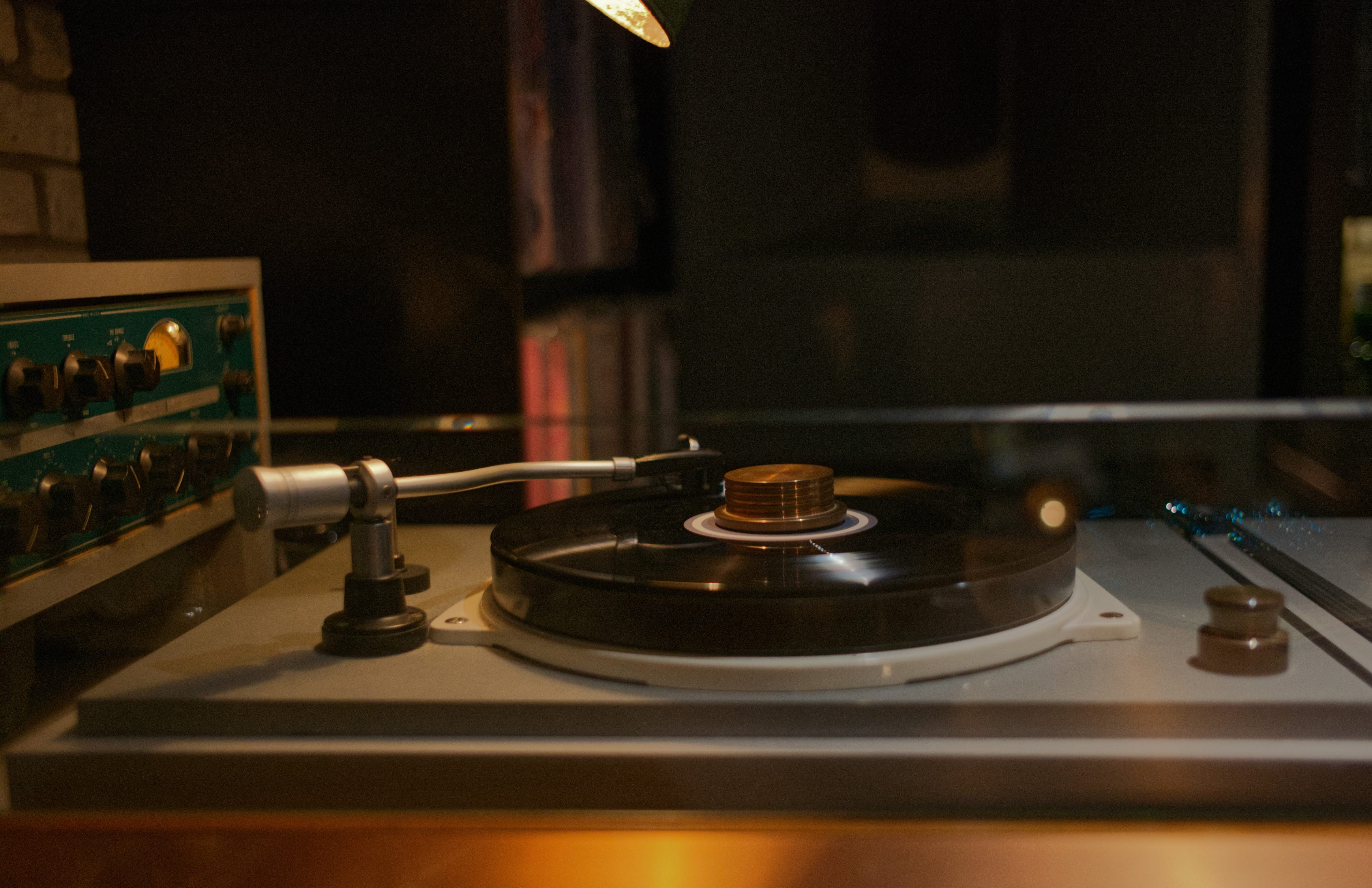 A turntable playing a vinyl record at RECORD BAR analog