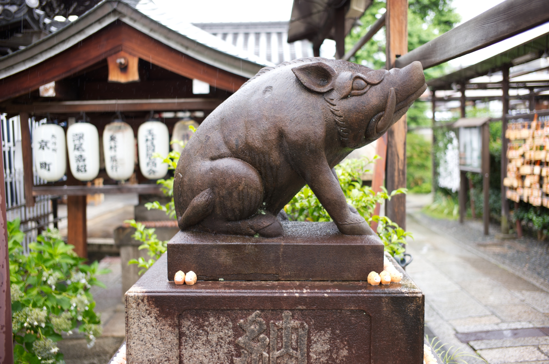 A bronze boar statue at Goō Shrine in Kyoto